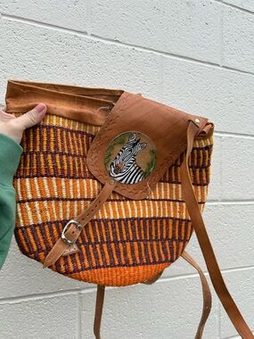 handcrafted African sisal bag woven natural fibers and a leather strap zebra
